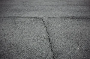 Close up of cracked asphalt pavement