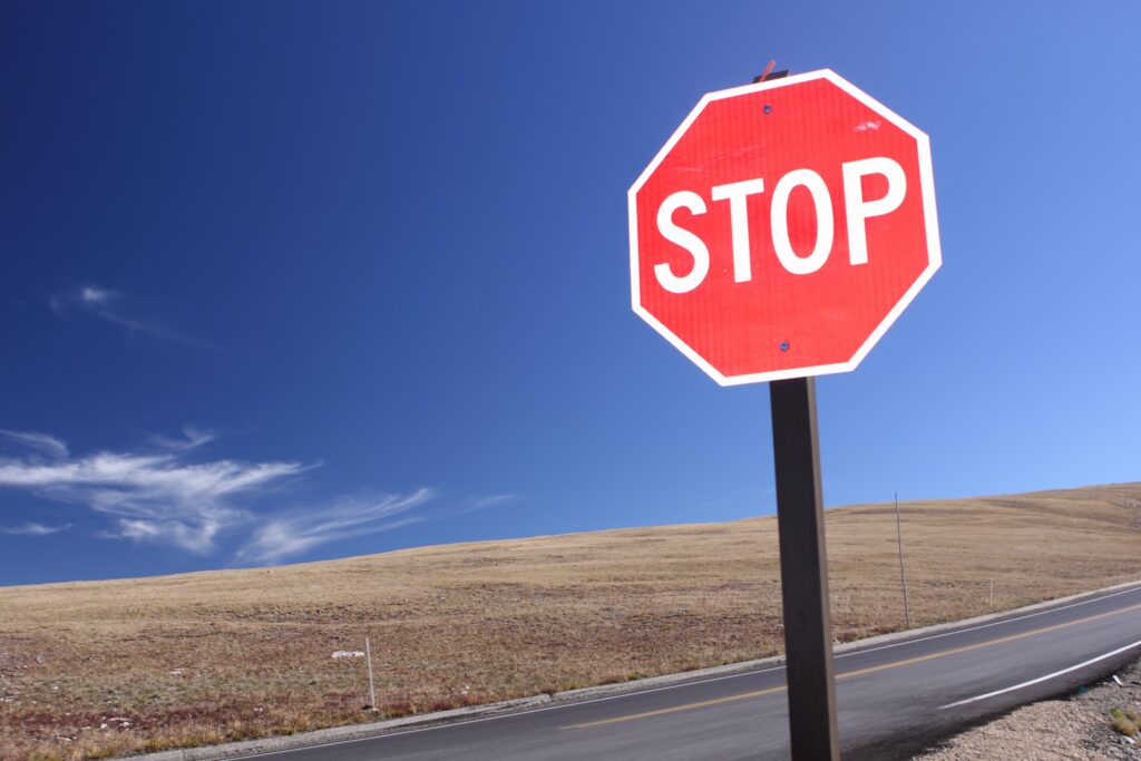 red stop sign along road